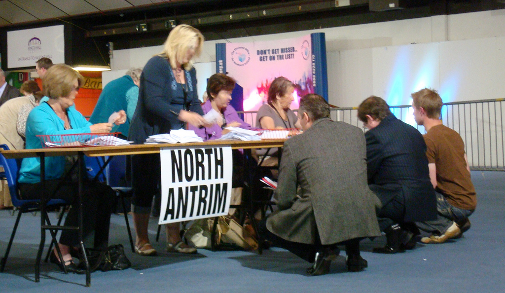 Ian Paisley Junior praying for DUP votes in North Antrim at the 2009 European Election verification in the Kings Hall ... or trying to see first preferences