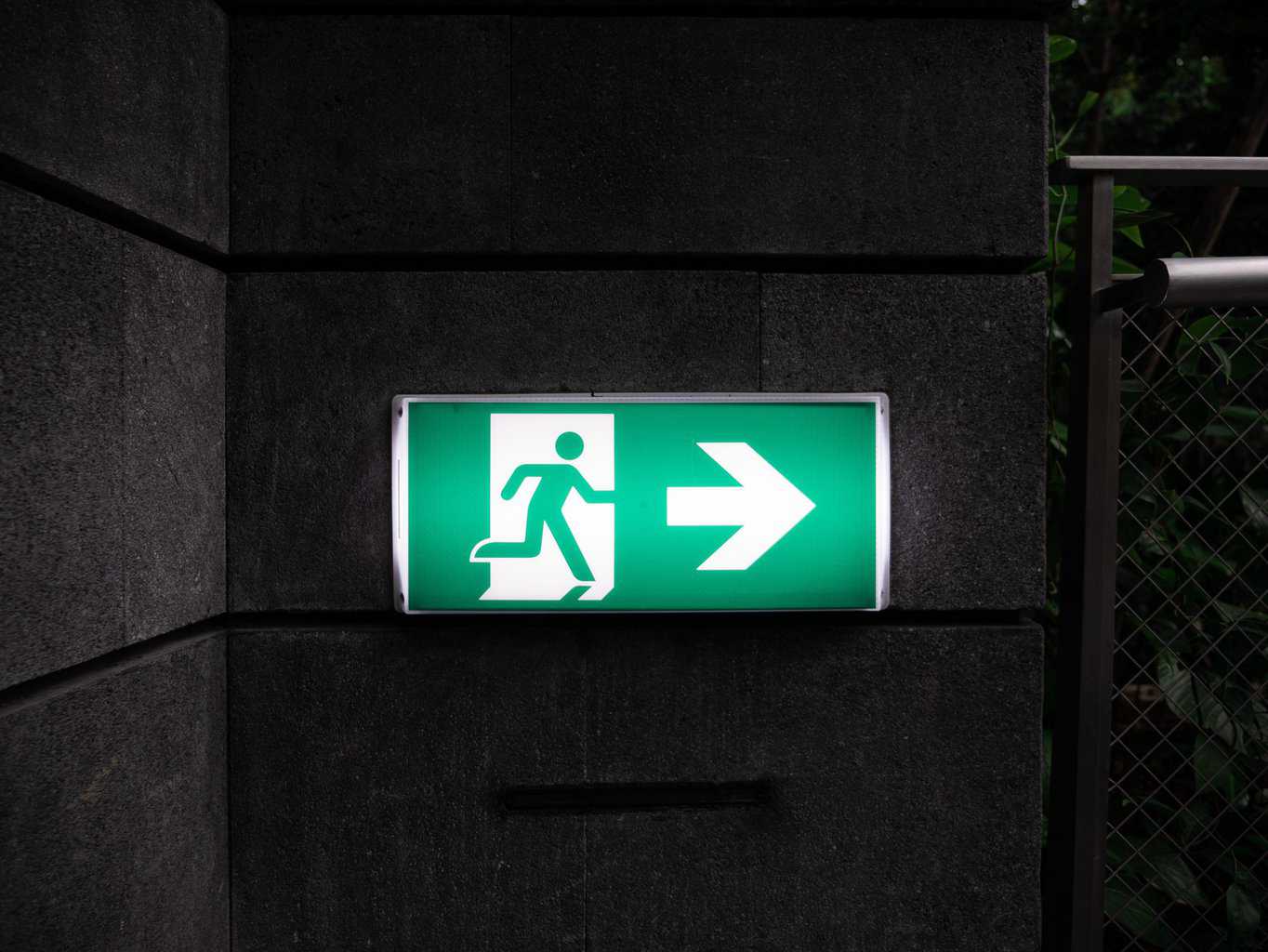 white and green Exit sign